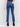 Indigo blue denim jeans with a tulip hem and bootcut design by Charlie B. Featuring a mid-rise and frayed hem details.