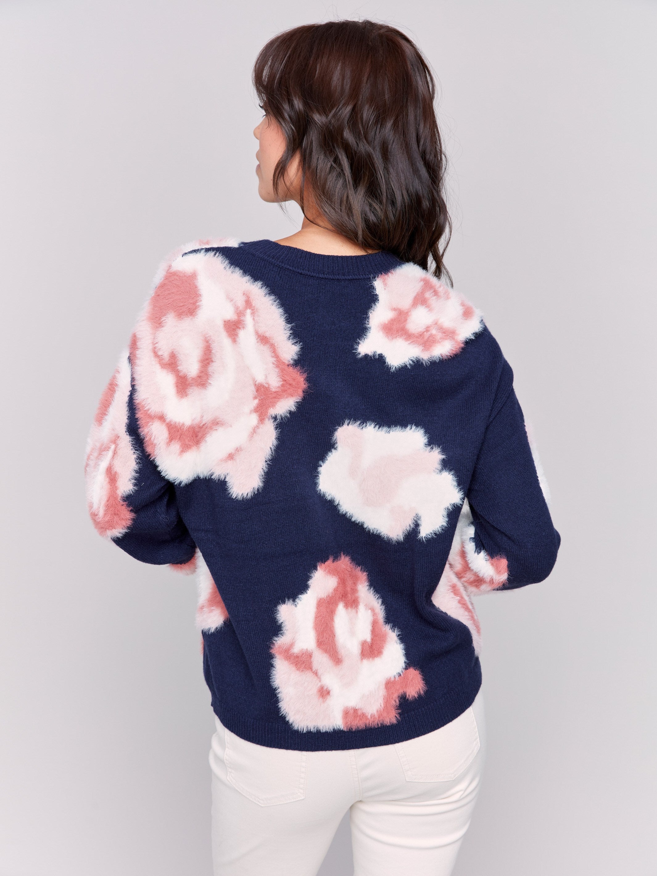 Navy fuzzy jacquard knit sweater with a floral pink pattern, featuring a crew neck and drop-shoulder design by Charlie B.