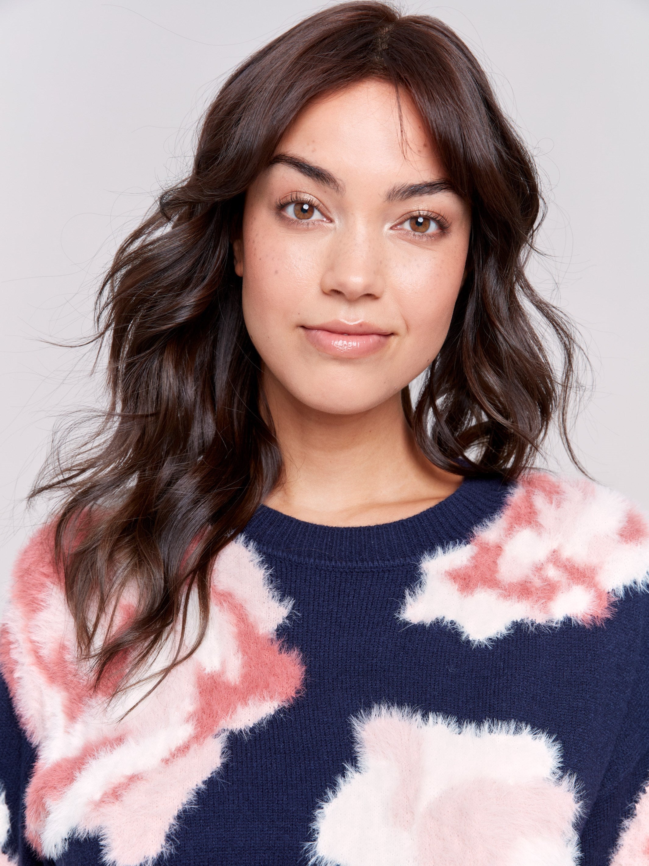 Navy fuzzy jacquard knit sweater with a floral pink pattern, featuring a crew neck and drop-shoulder design by Charlie B.