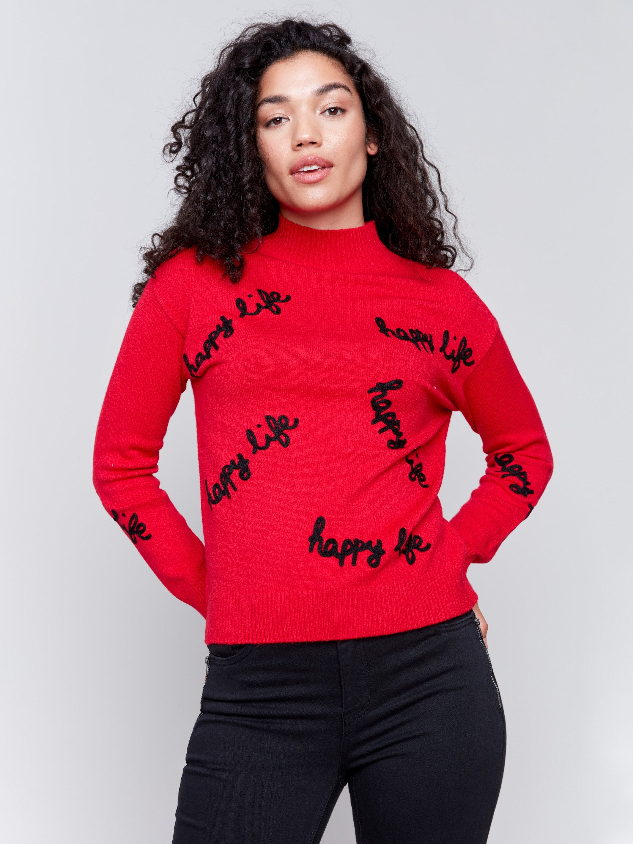 Cranberry red mock neck sweater with 'happy life' text design in plush knit by Charlie B.