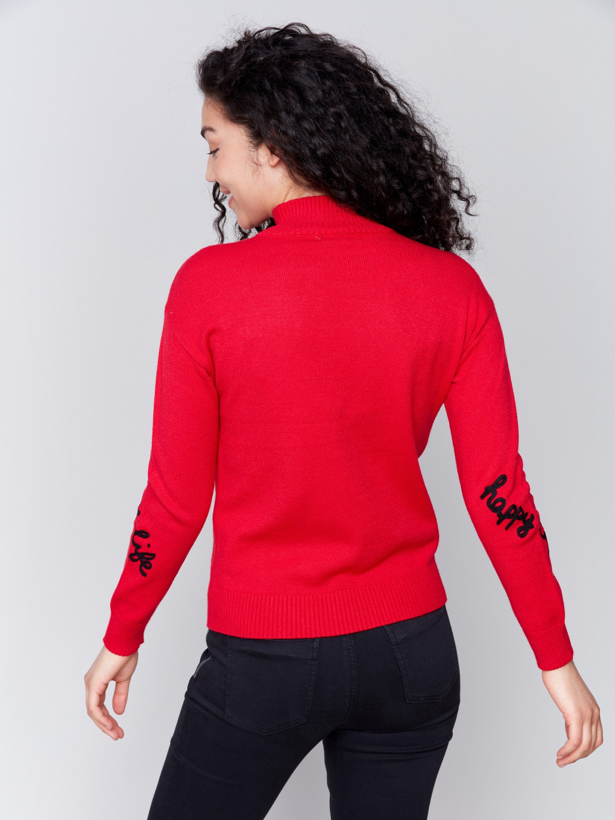 Cranberry red mock neck sweater with 'happy life' text design in plush knit by Charlie B.