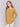 Amber yellow knit sweater with a crew neckline, long ribbed sleeves, and back lace-up eyelet details by Charlie B.