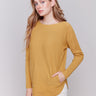 Amber yellow knit sweater with a crew neckline, long ribbed sleeves, and back lace-up eyelet details by Charlie B.