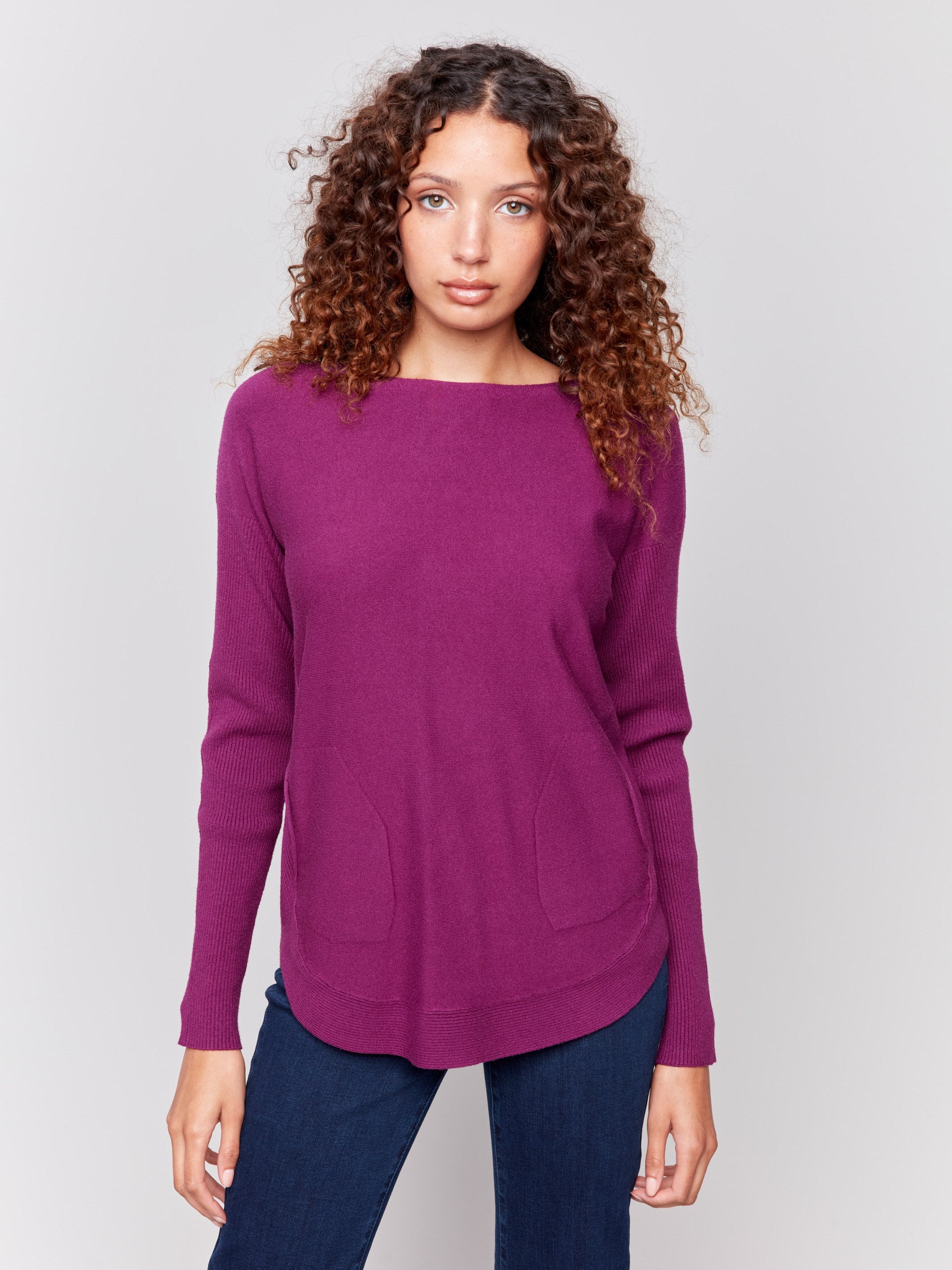 Mulberry knit sweater with a crew neckline, long ribbed sleeves, and back lace-up eyelet details by Charlie B.