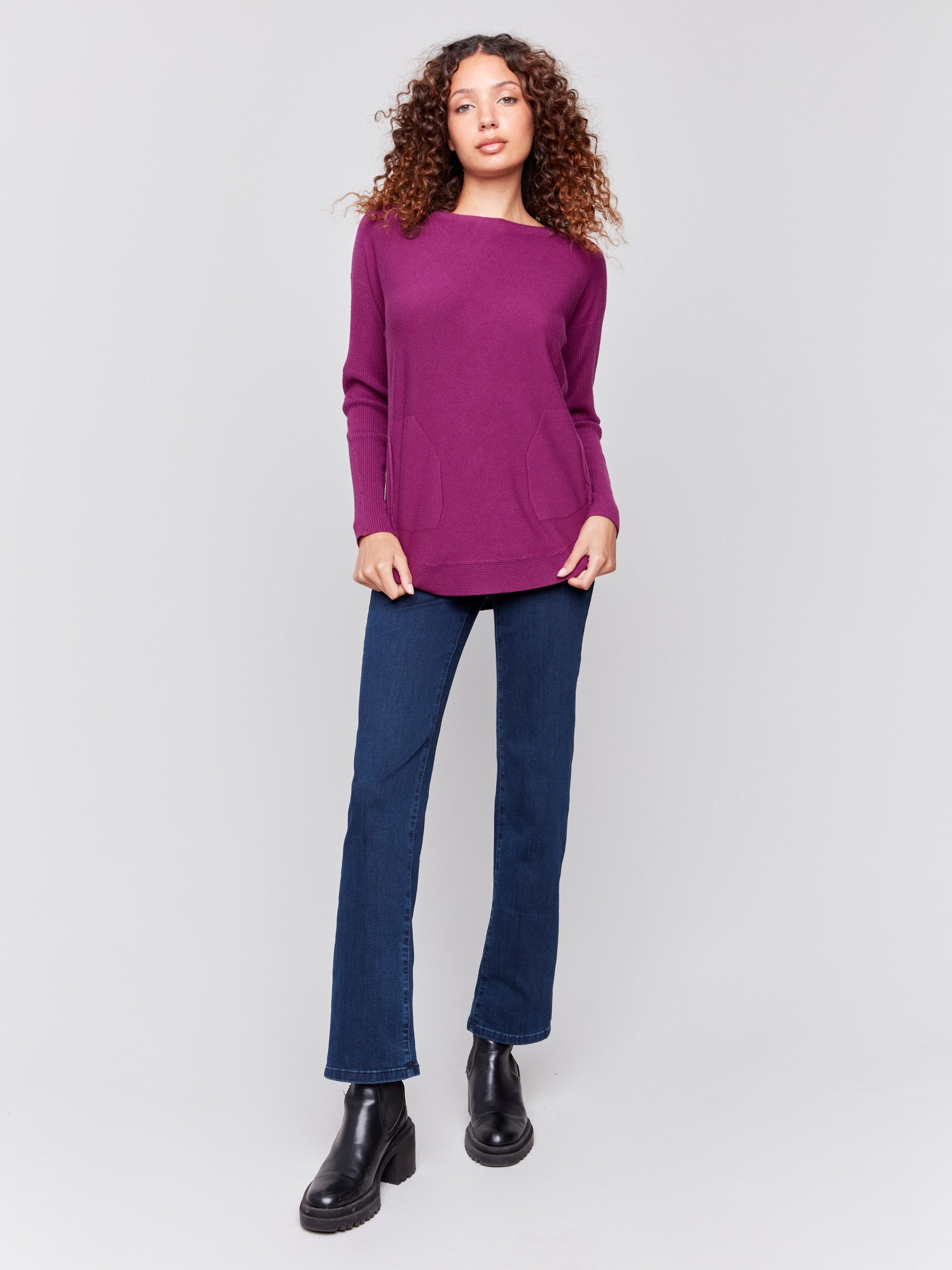 Mulberry knit sweater with a crew neckline, long ribbed sleeves, and back lace-up eyelet details by Charlie B.