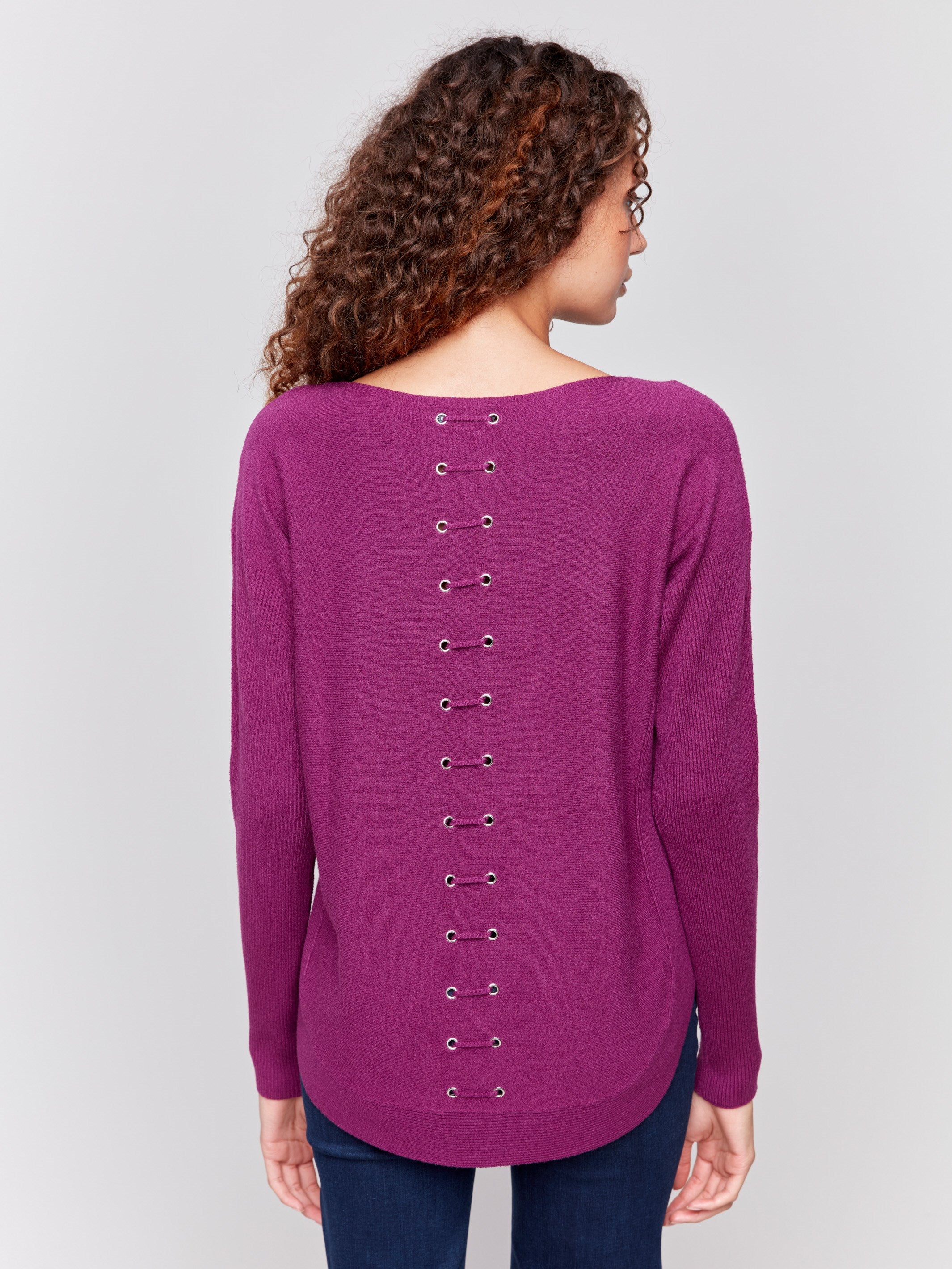 Mulberry knit sweater with a crew neckline, long ribbed sleeves, and back lace-up eyelet details by Charlie B.