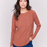 Terracotta knit sweater with a crew neckline, long ribbed sleeves, and back lace-up eyelet details by Charlie B.