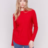 Cranberry red long-sleeved knit sweater with lace-up cuffs, rounded hem, and front pockets by Charlie B.