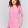 Magenta pink long-sleeved knit sweater with lace-up cuffs, rounded hem, and front pockets by Charlie B.