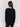 Black long-sleeved knit sweater with lace-up cuffs, rounded hem, and front pockets by Charlie B.