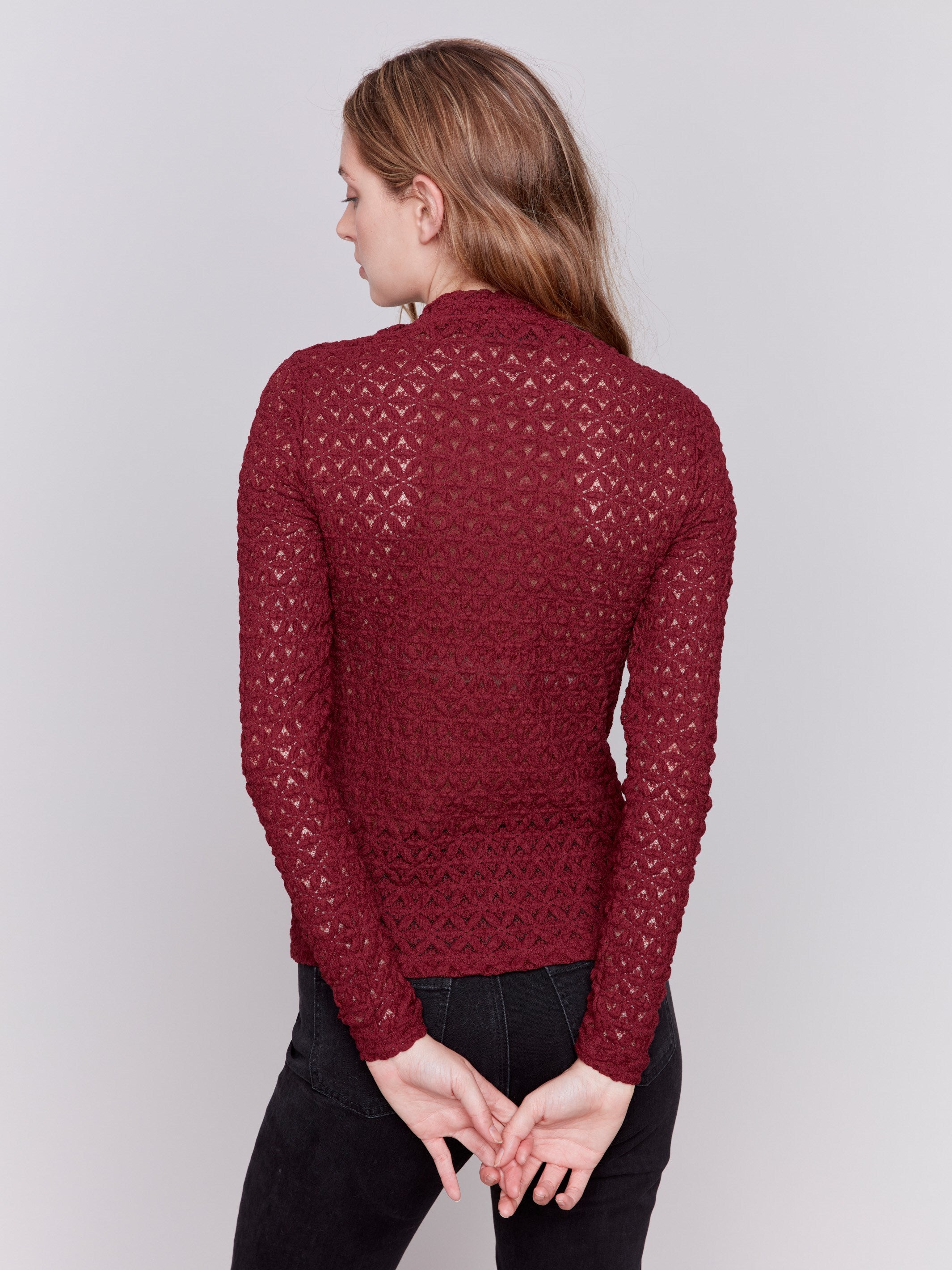 Cabernet red lace mock neck long sleeve top by Charlie B. Detailed lace pattern with long sleeves and fitted silhouette.