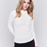 White lace mock neck long sleeve top by Charlie B. Detailed lace pattern with long sleeves and fitted silhouette.