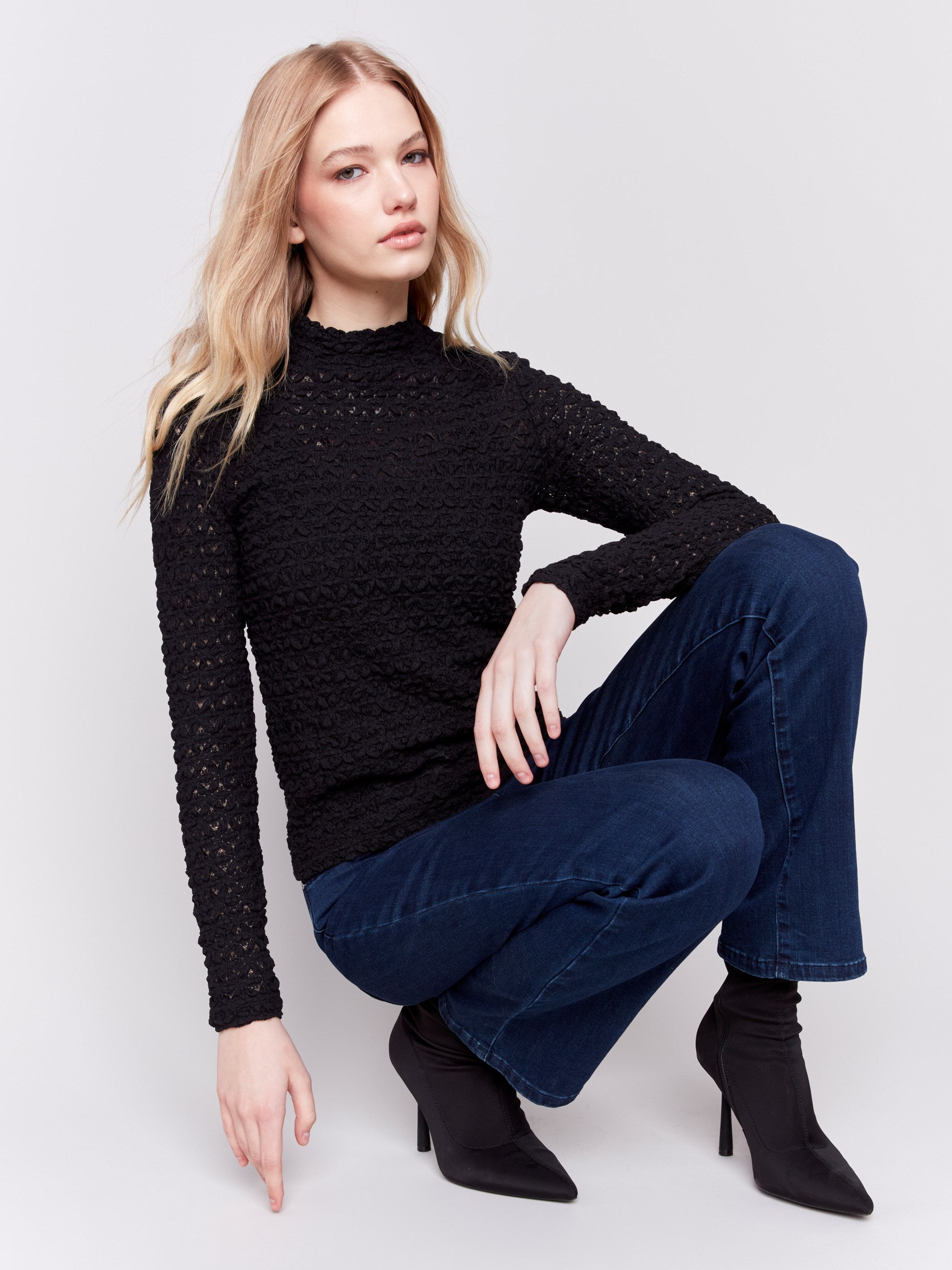 Black lace mock neck long sleeve top by Charlie B. Detailed lace pattern with long sleeves and fitted silhouette.