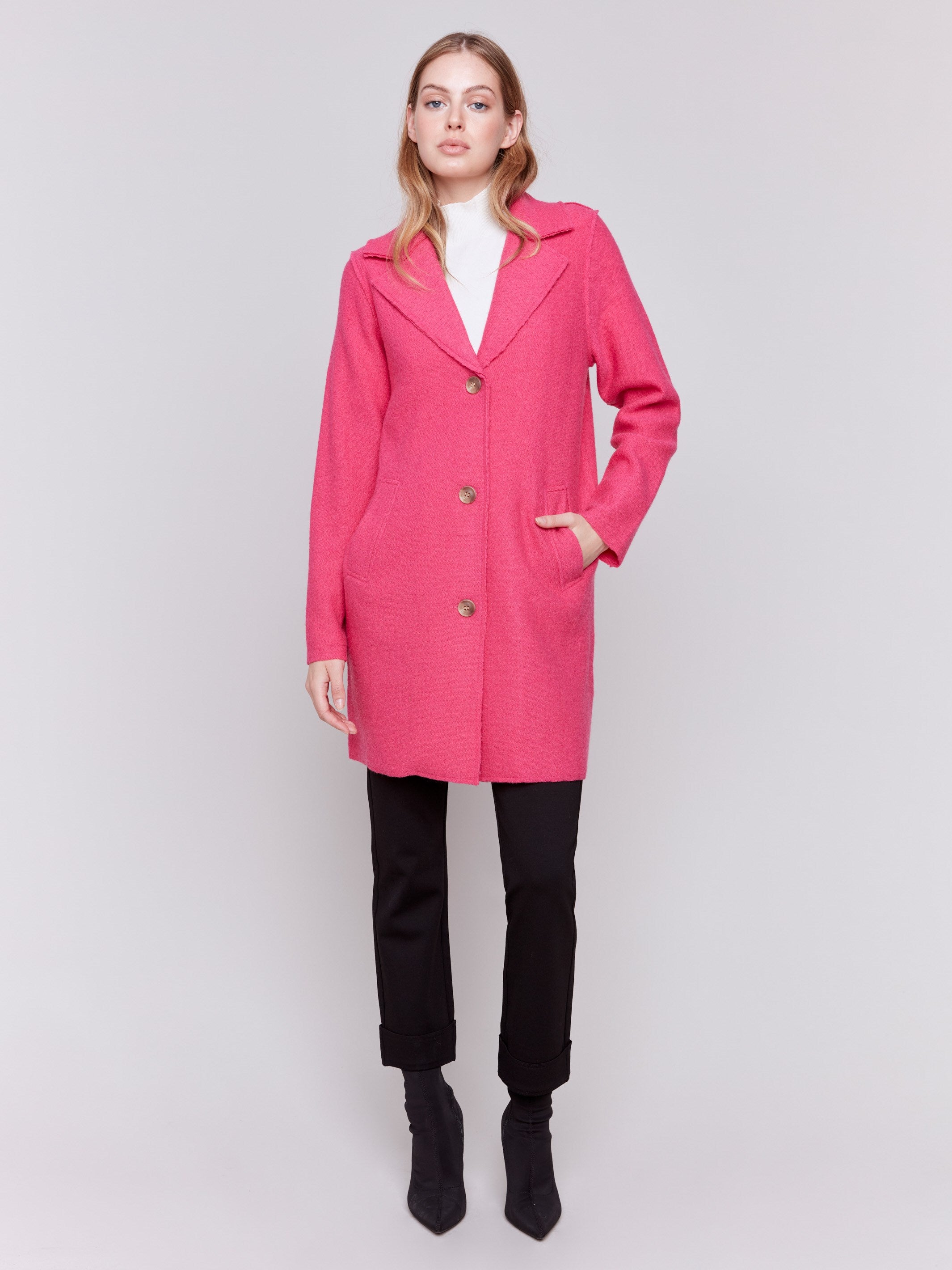 Magenta pink long wool coat with lapel notch collar and button closures, featuring front welt pockets by Charlie B.