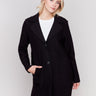 Black long wool coat with lapel notch collar and button closures, featuring front welt pockets by Charlie B.