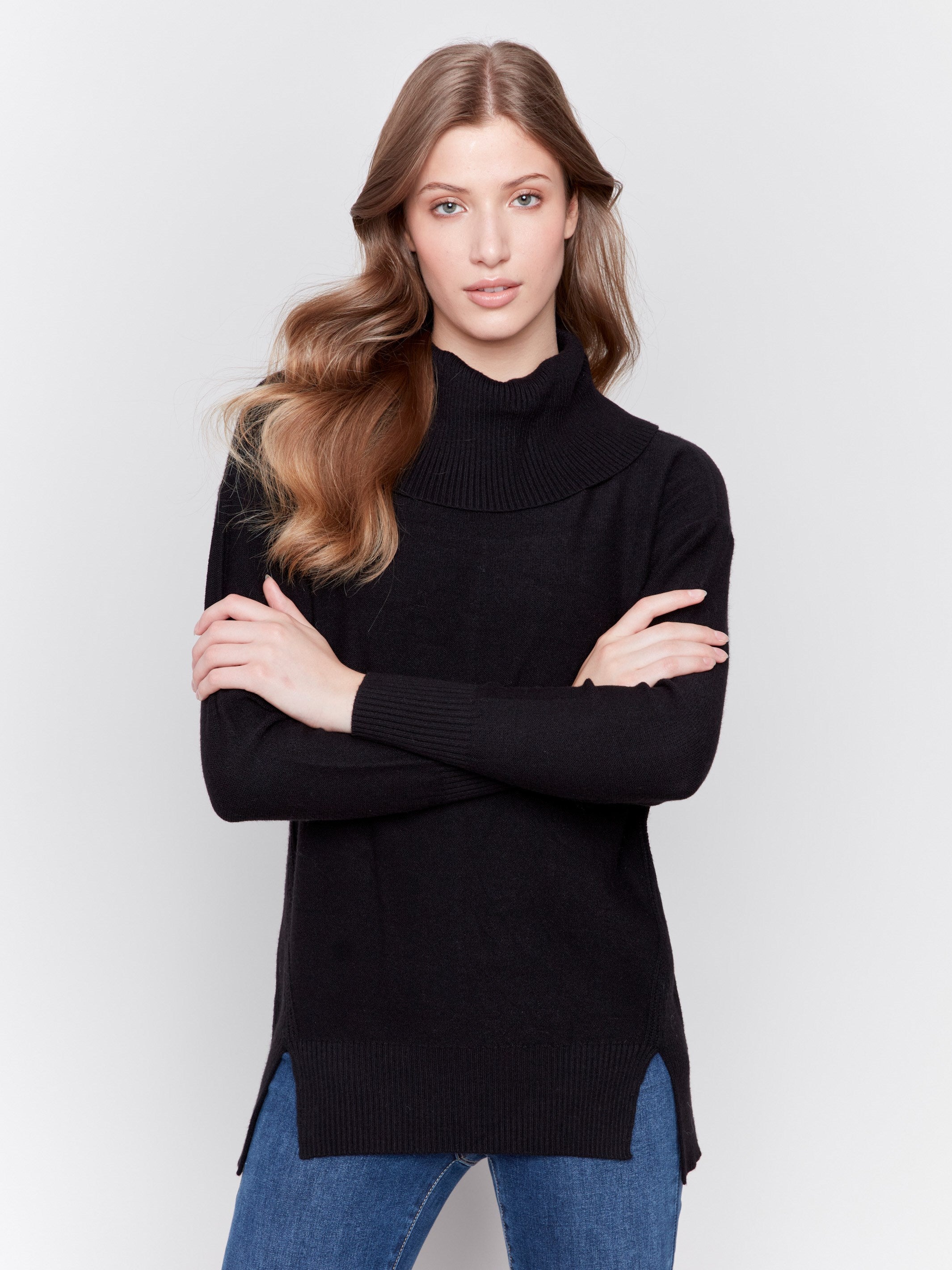 Elegant black long-sleeve sweater with cowl neck and side seams forward design by Charlie B.