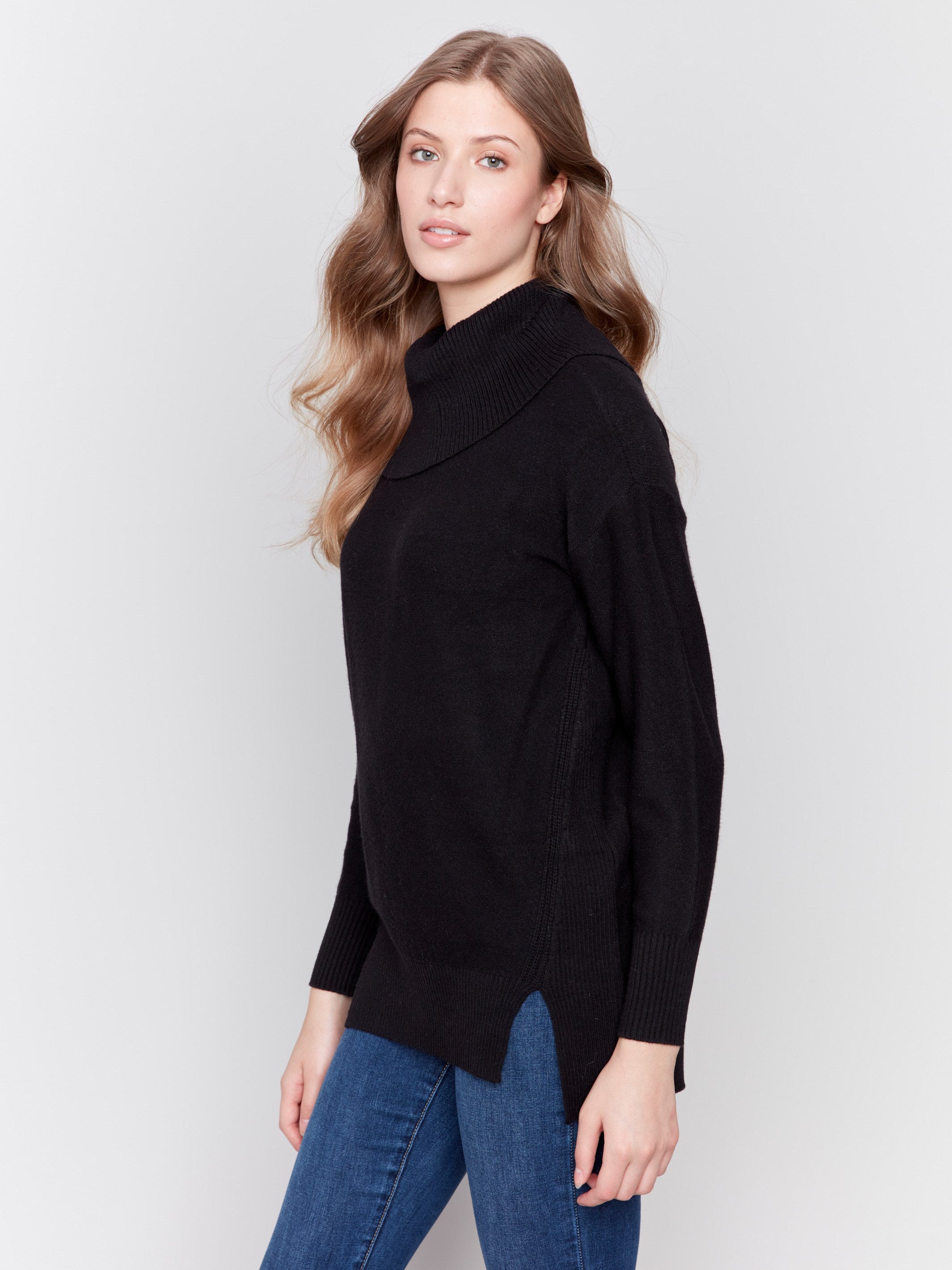 Elegant black long-sleeve sweater with cowl neck and side seams forward design by Charlie B.