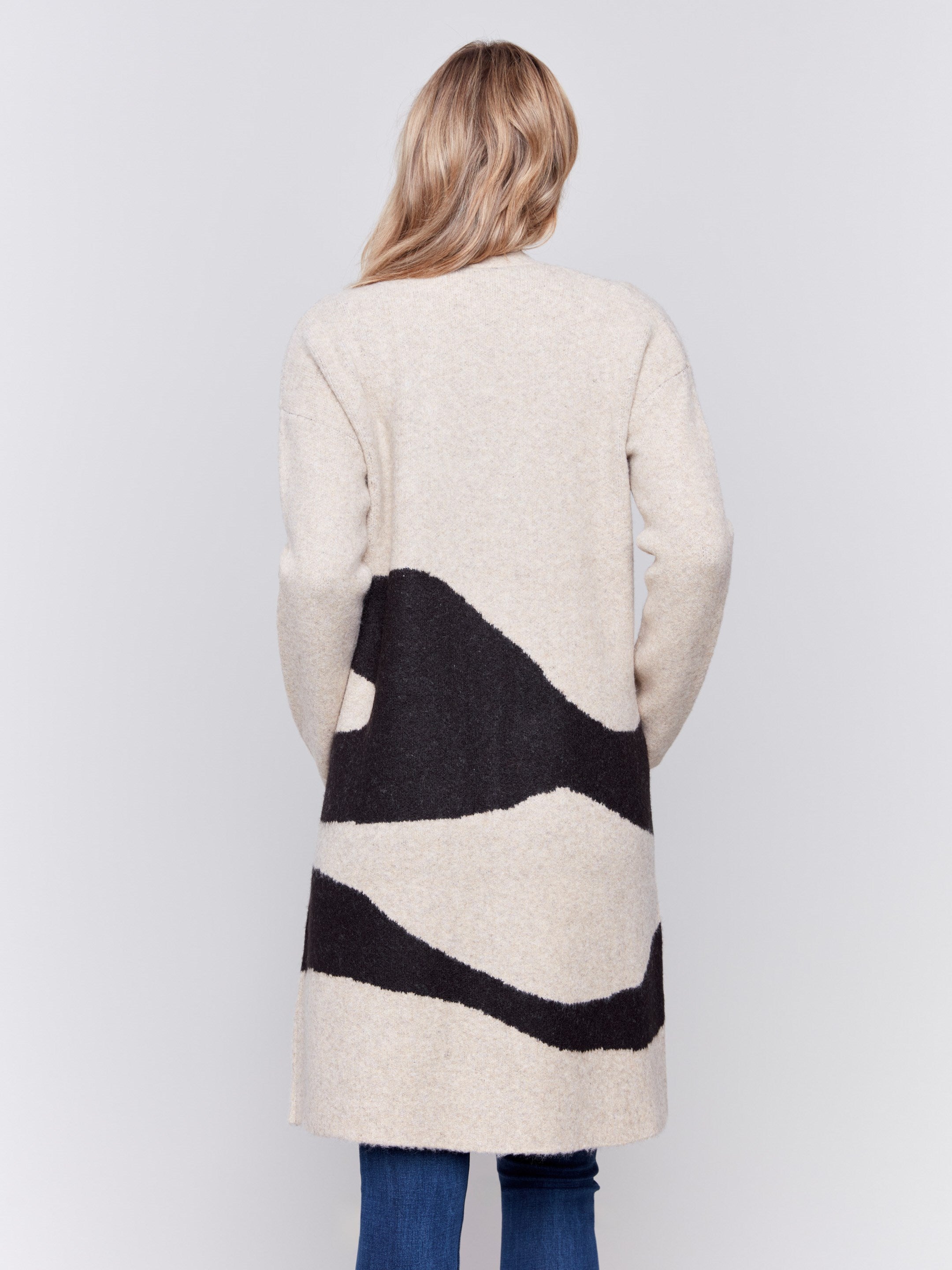 Beige long jacquard knit cardigan with black abstract pattern by Charlie B.