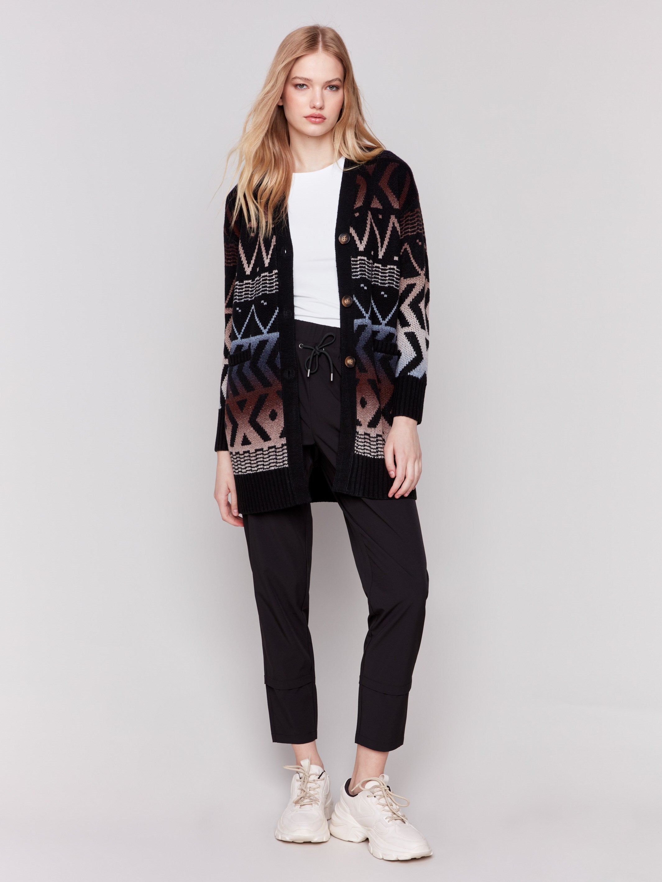 Long ombre cardigan with geometric patterns in black, brown, and blue, featuring a V-neck and front pockets by Charlie B.