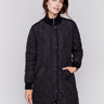 Black long quilted puffer jacket with rib knit detail, zipper front, and front pockets by Charlie B.