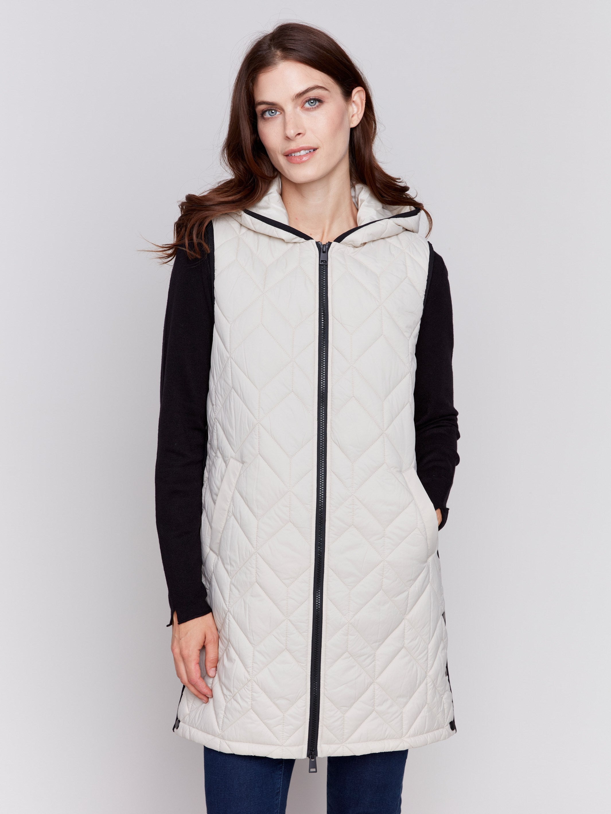 Almond beige long quilted puffer vest with zip closure and hood by Charlie B.