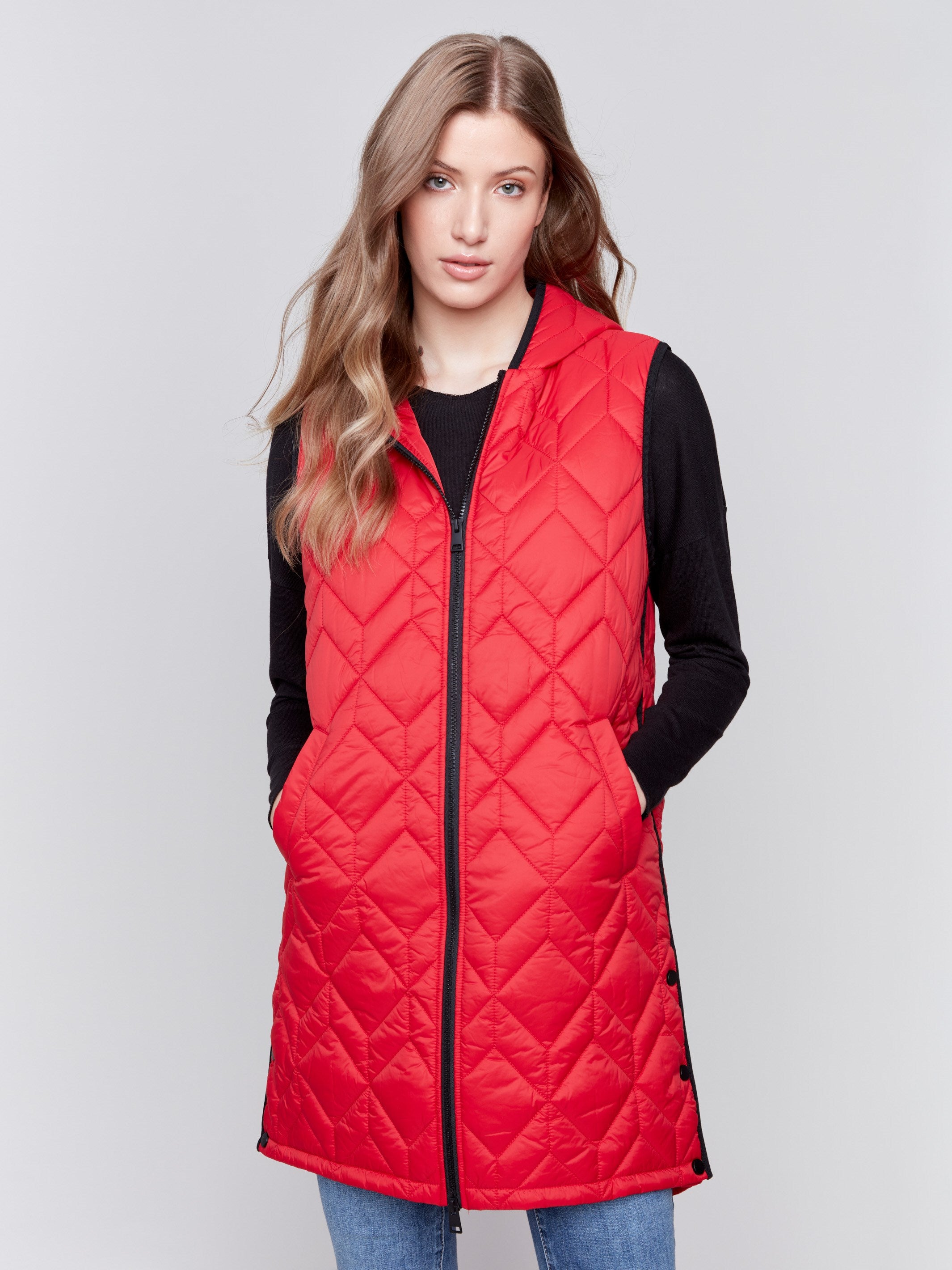 Cranberry red long quilted puffer vest with zip closure and hood by Charlie B.