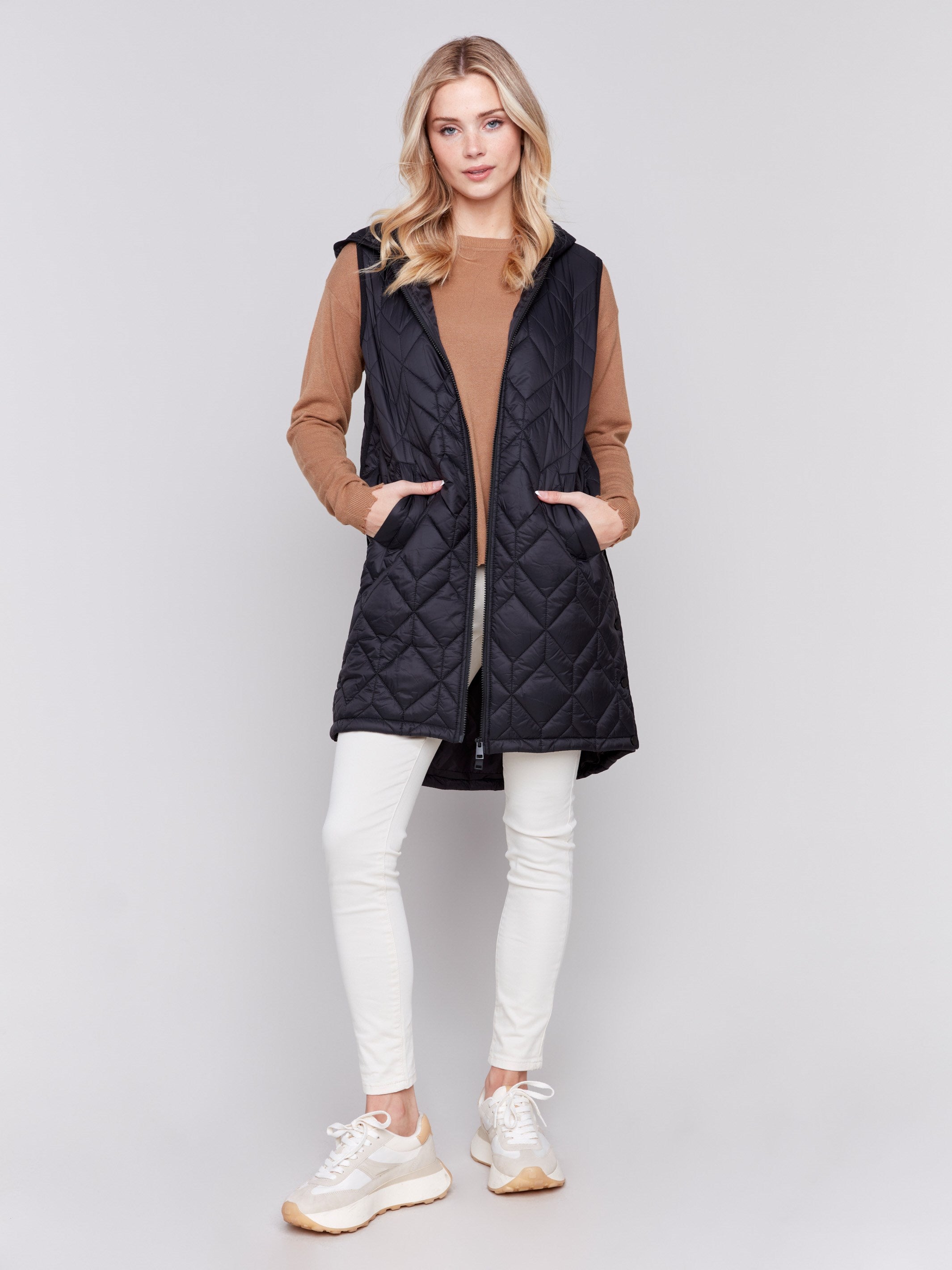 Black long quilted puffer vest with zip closure and hood by Charlie B.