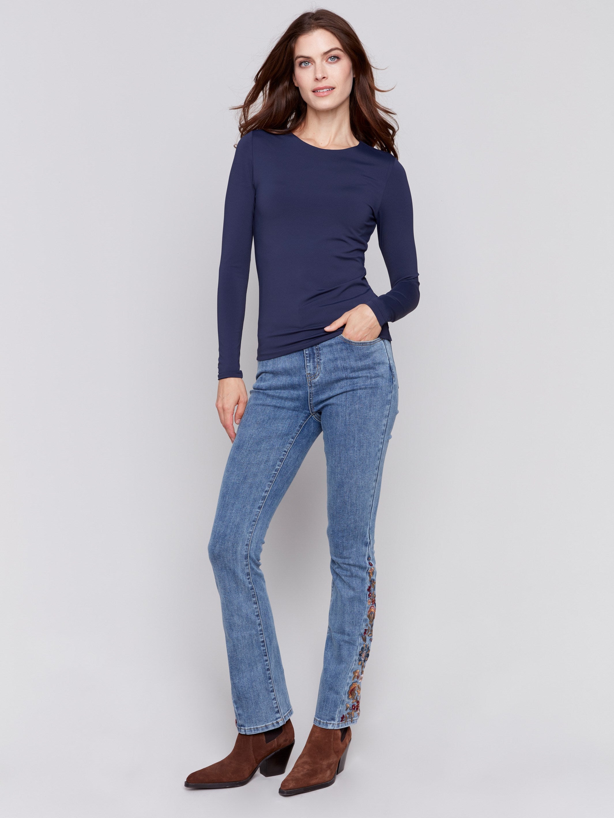 Navy blue long-sleeve top with crew neckline, featuring a fitted silhouette by Charlie B.