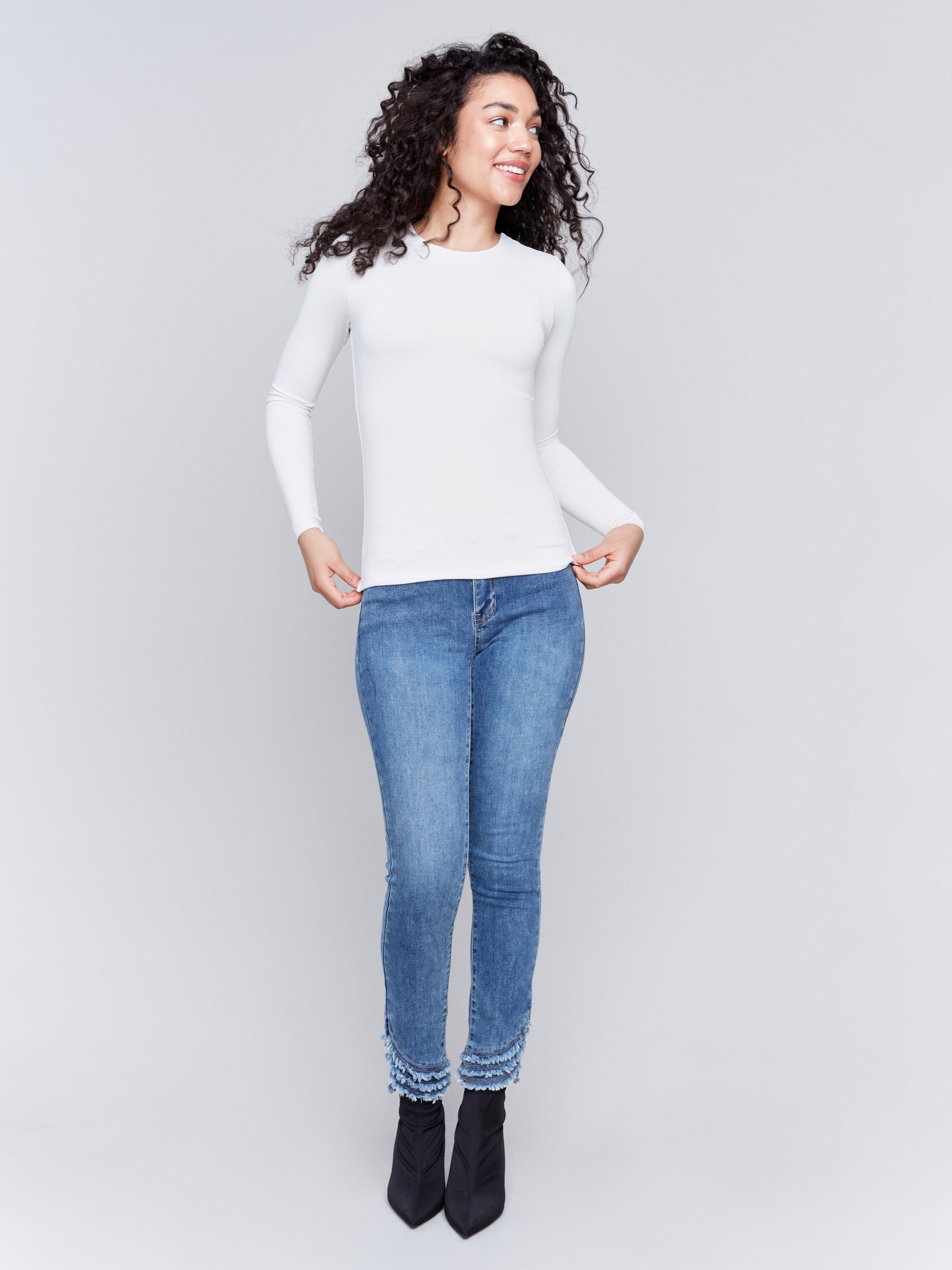 Natural white long-sleeve top with crew neckline, featuring a fitted silhouette by Charlie B.