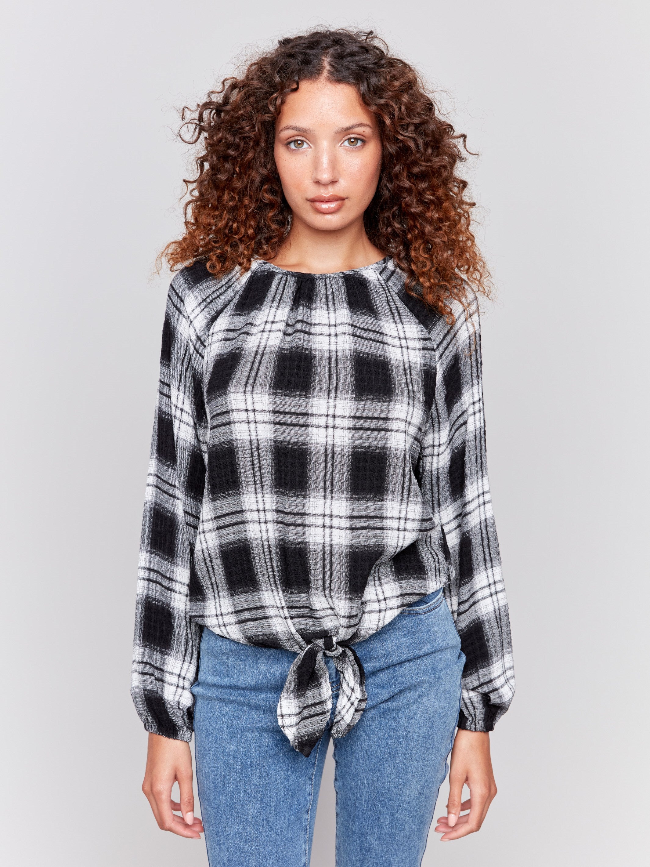 Pepper long-sleeve blouse with balloon sleeves and tie-front detail in a plaid check pattern by Charlie B.