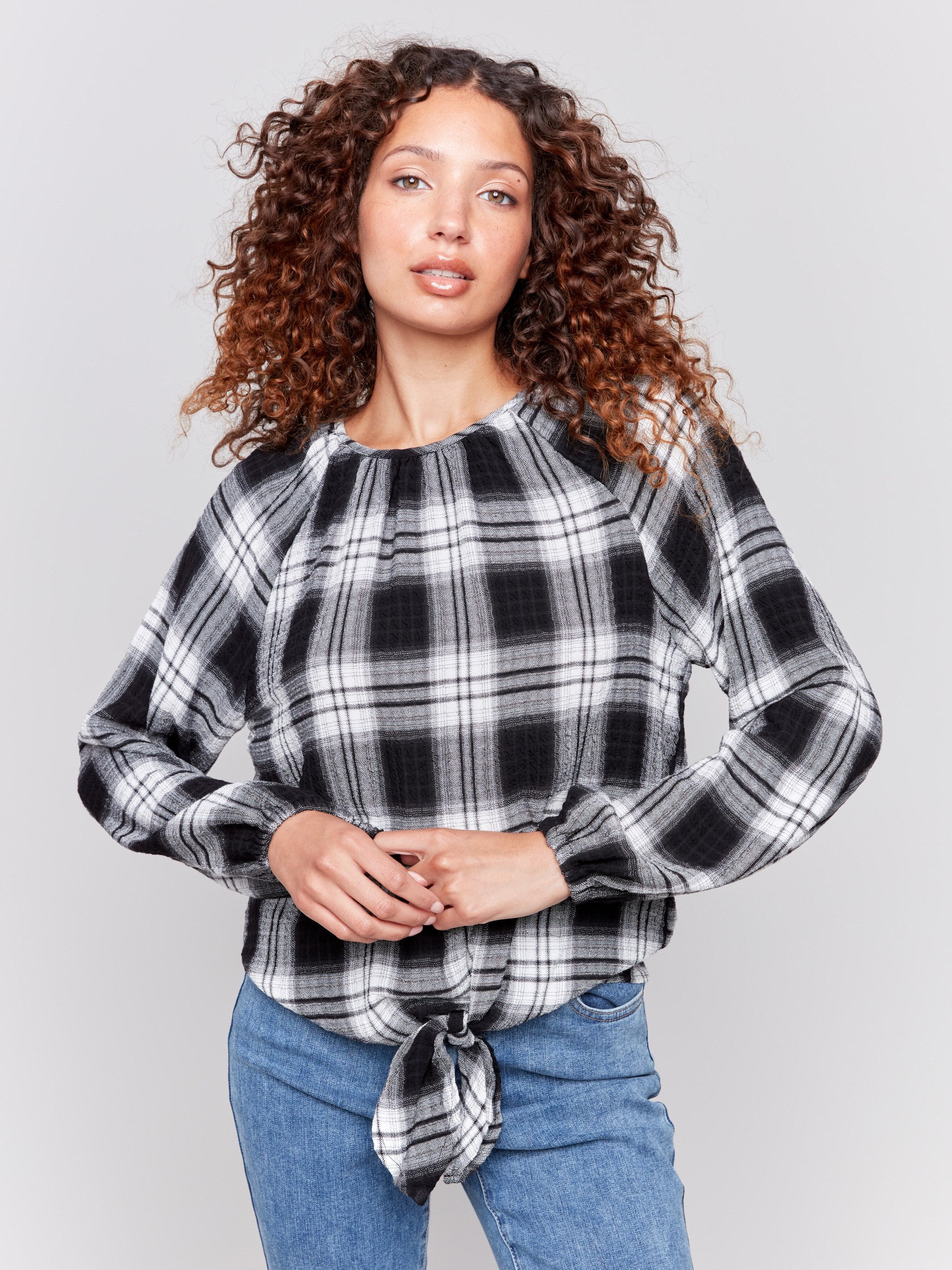 Pepper long-sleeve blouse with balloon sleeves and tie-front detail in a plaid check pattern by Charlie B.