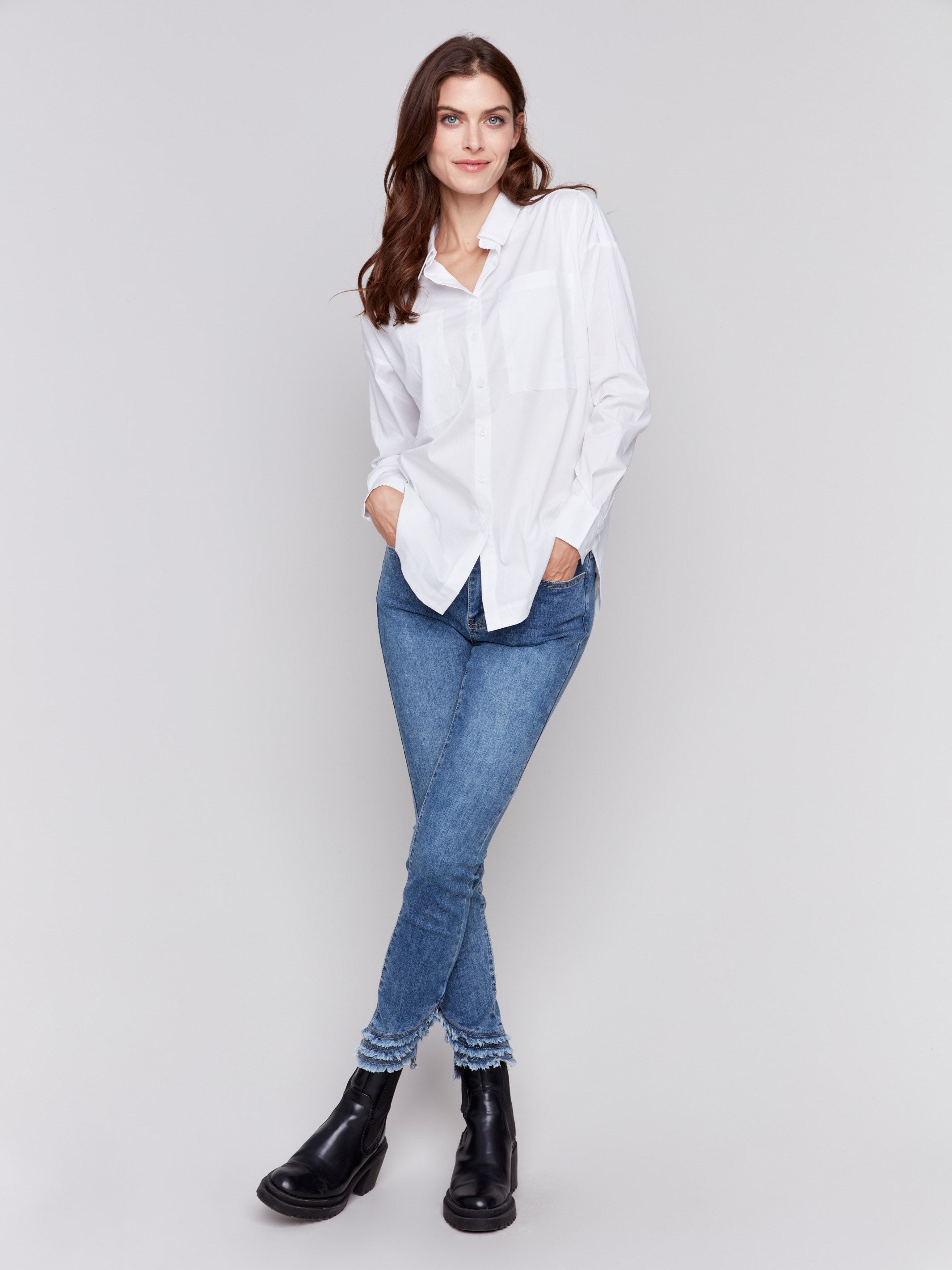 White loose fit poplin shirt with drop shoulders, rounded hem, and patch pockets by Charlie B.