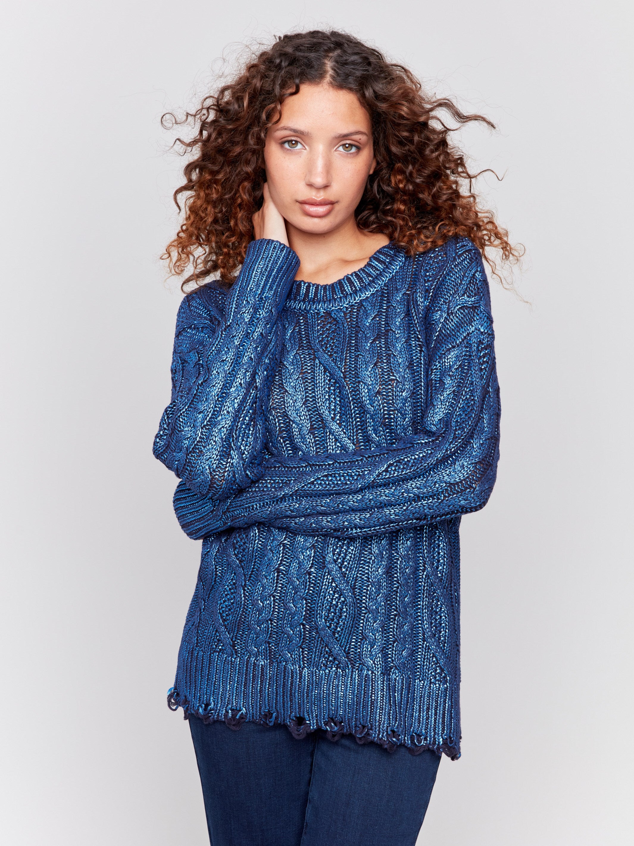 Blue metallic cable knit sweater with long sleeves and a crew neckline by Charlie B.