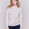 Écru beige sweater with heart embroidery, mock neck, and long sleeves by Charlie B.