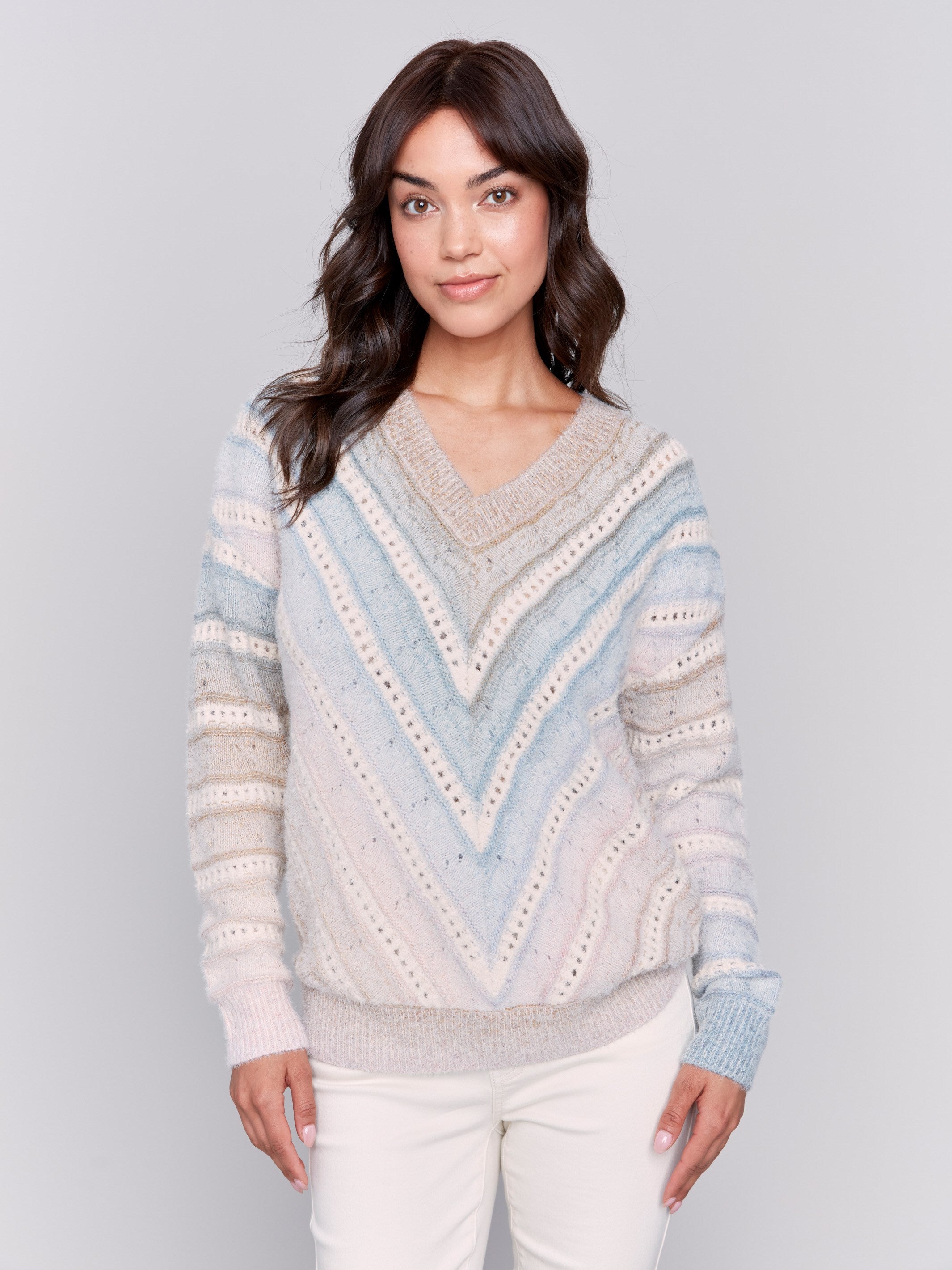 V-neck knit sweater with ombre chevron pattern in pastel shades, long sleeves, and ribbed cuffs by Charlie B.