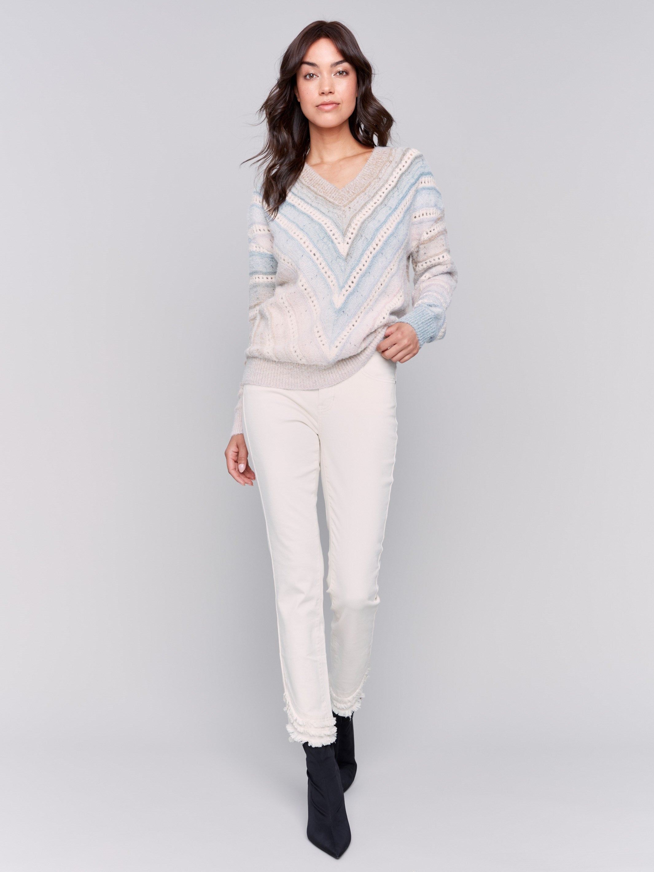 V-neck knit sweater with ombre chevron pattern in pastel shades, long sleeves, and ribbed cuffs by Charlie B.