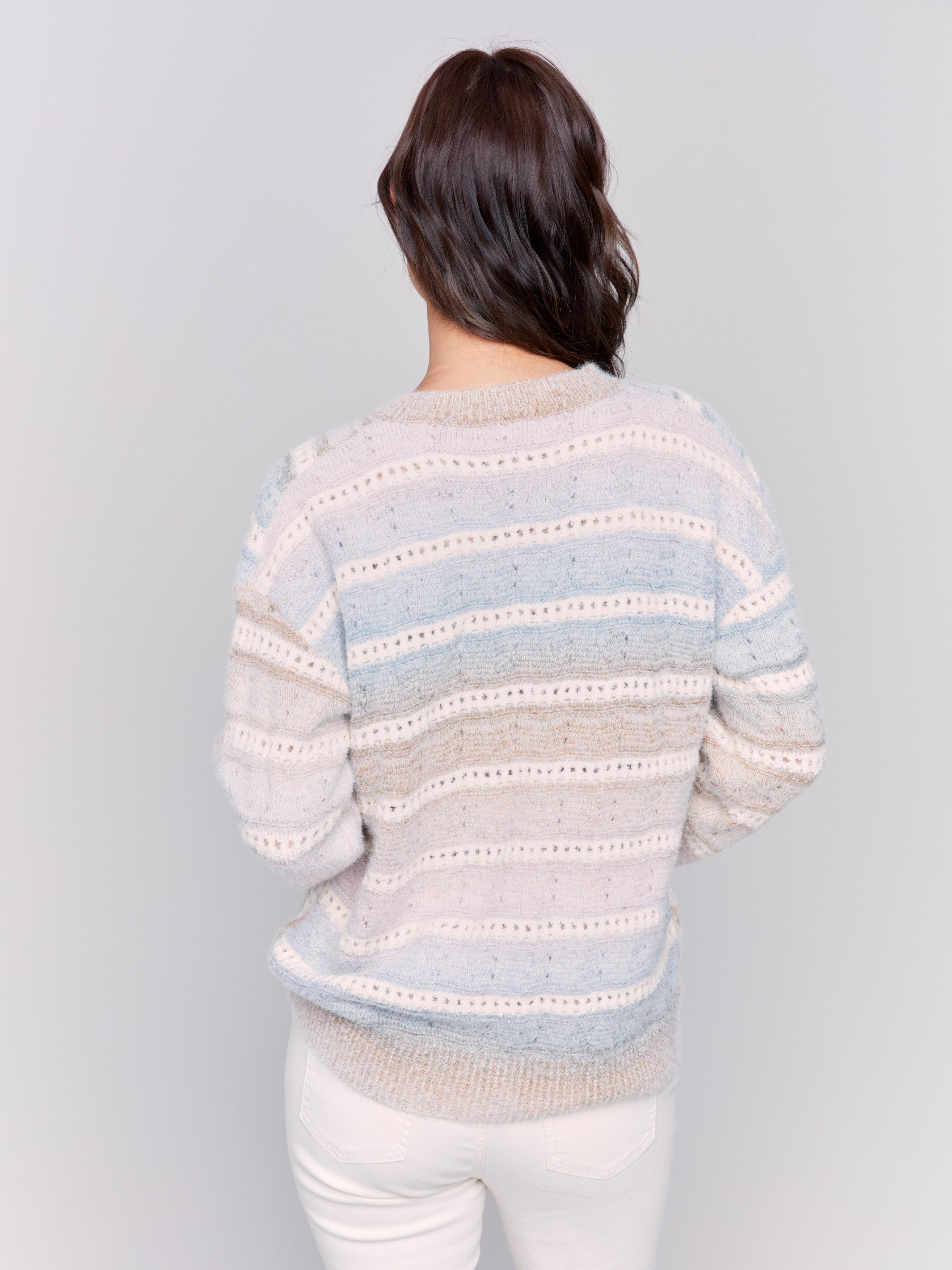 V-neck knit sweater with ombre chevron pattern in pastel shades, long sleeves, and ribbed cuffs by Charlie B.