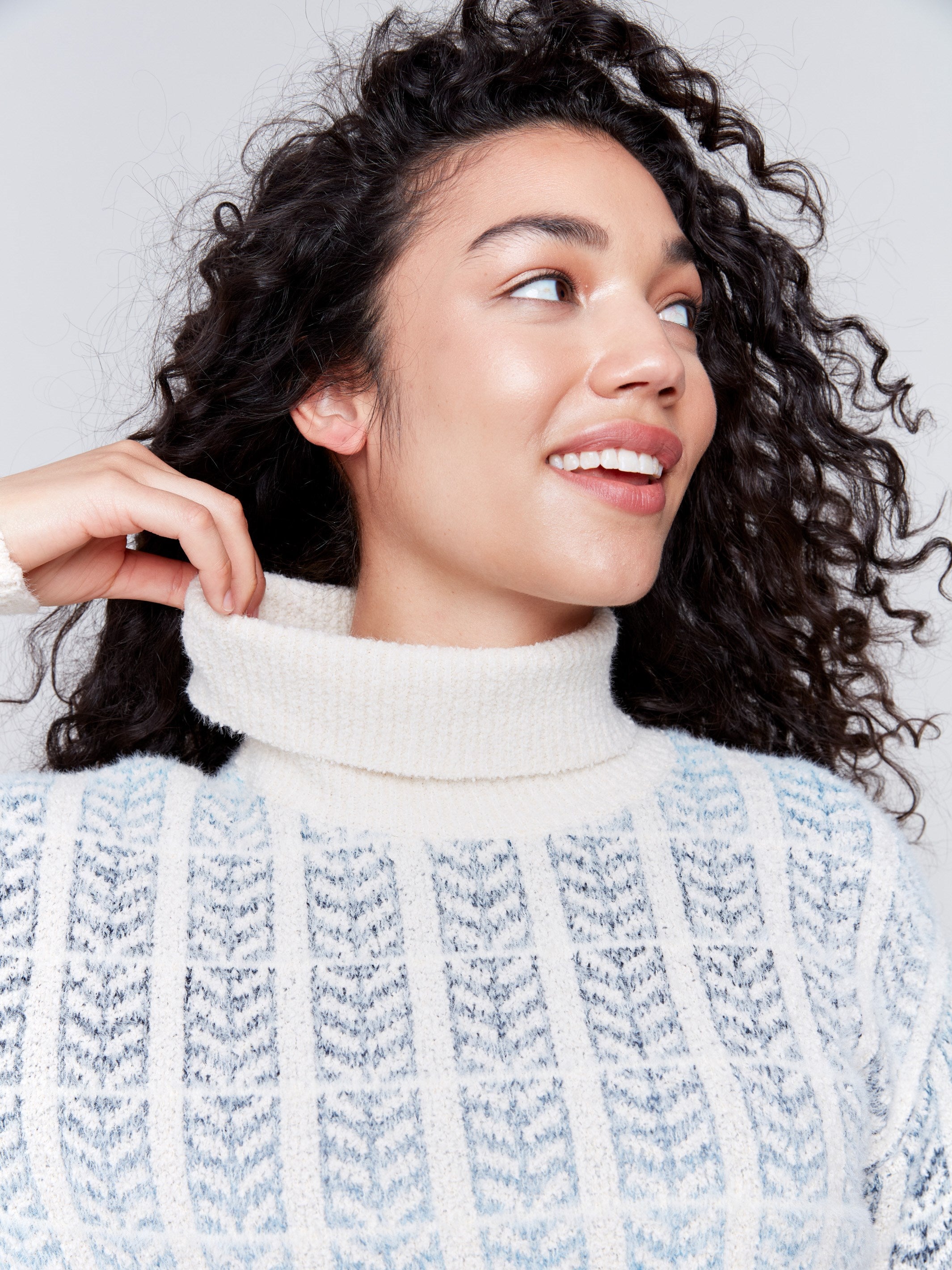 Women's frost blue jacquard knit turtleneck sweater with long sleeves in a cool color palette by Charlie B.