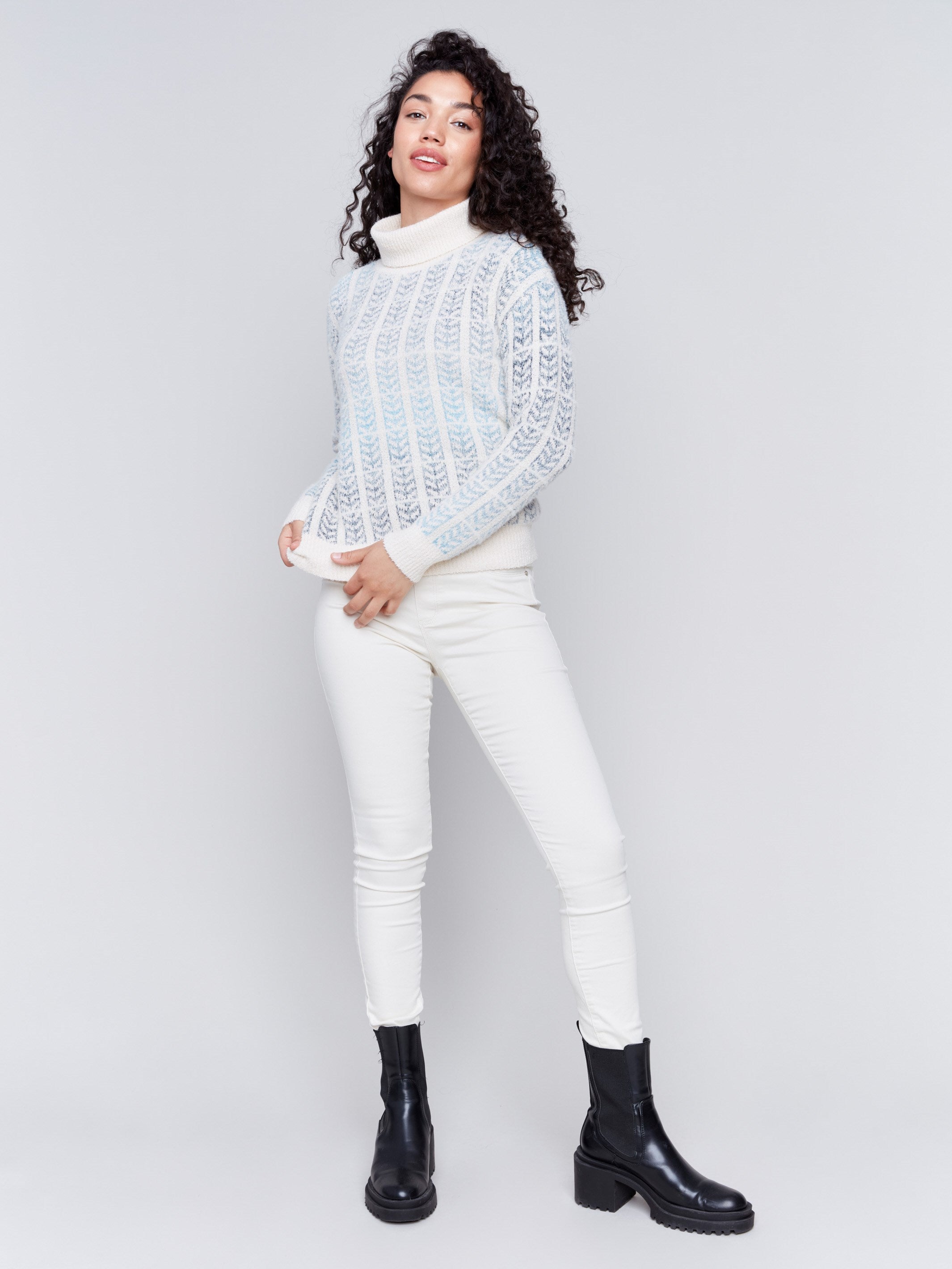 Women's frost blue jacquard knit turtleneck sweater with long sleeves in a cool color palette by Charlie B.