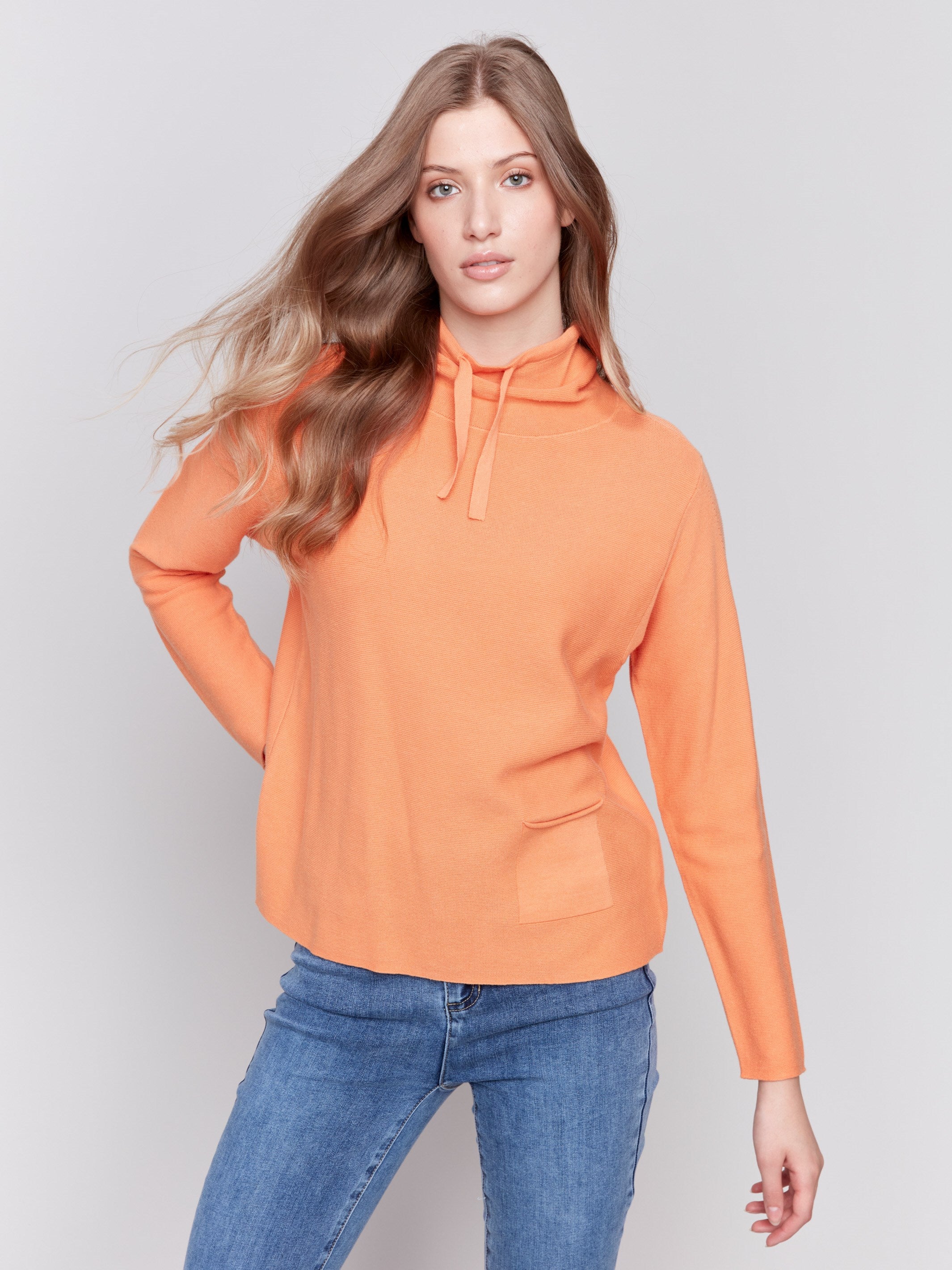 Orange ottoman cotton funnel neck sweater with a small front pocket, featuring long sleeves and a cozy style by Charlie B.