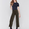 Green corduroy flare pants with front and back patch pockets, a regular rise, and cropped design by Charlie B.