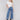 Medium blue jeans with front patch pockets and a flared leg, featuring a mid-rise by Charlie B.