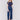 Indigo blue jeans with front patch pockets and a flared leg, featuring a mid-rise by Charlie B.