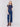 Indigo blue jeans with front patch pockets and a flared leg, featuring a mid-rise by Charlie B.