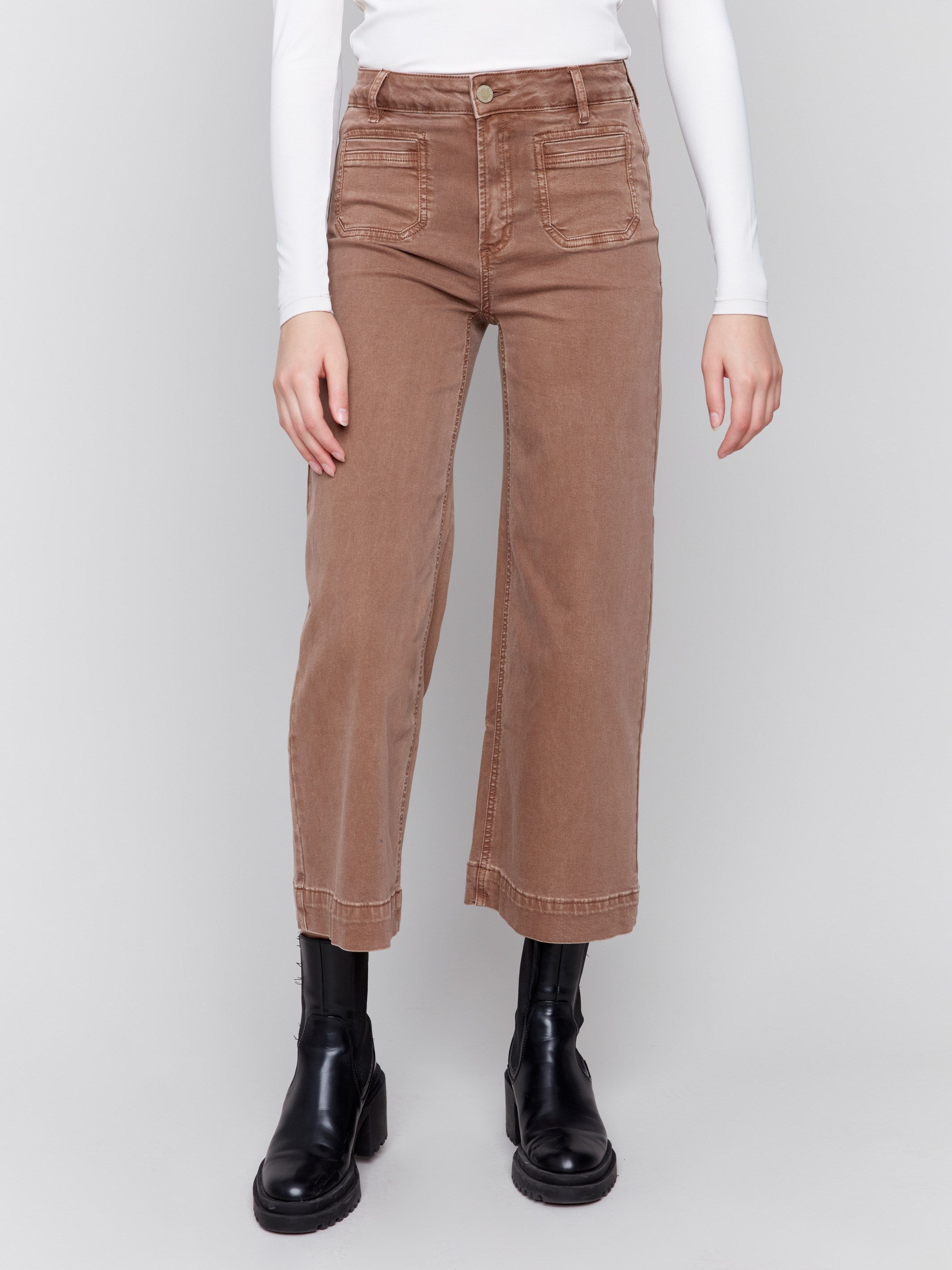 Brown cropped twill pants with front patch pockets and a flare leg by Charlie B.