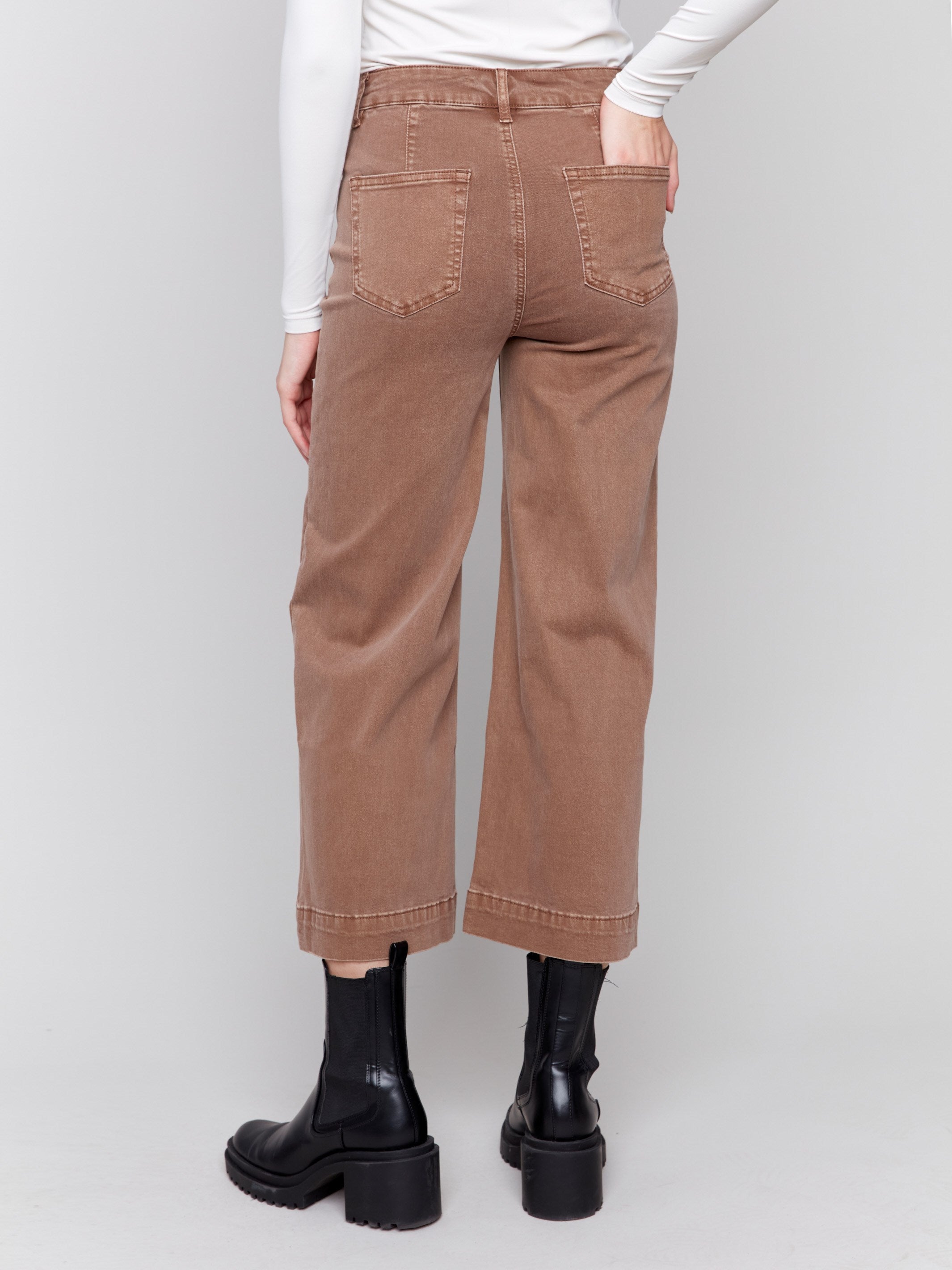 Brown cropped twill pants with front patch pockets and a flare leg by Charlie B.