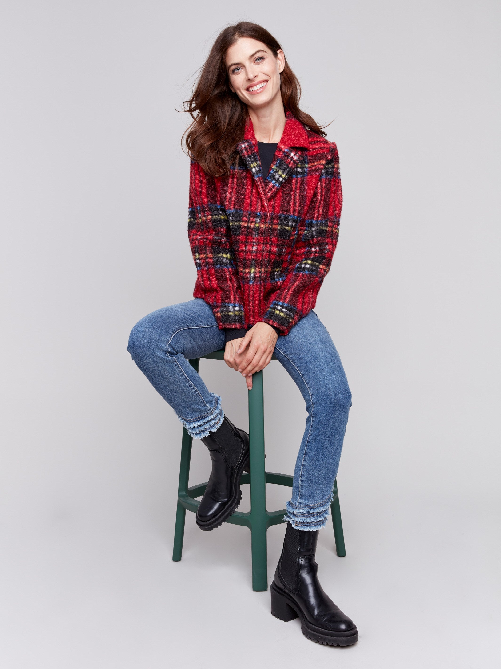 Short cranberry red plaid bouclé knit jacket with notch collar and welt pockets, featuring a full-button closure by Charlie B.