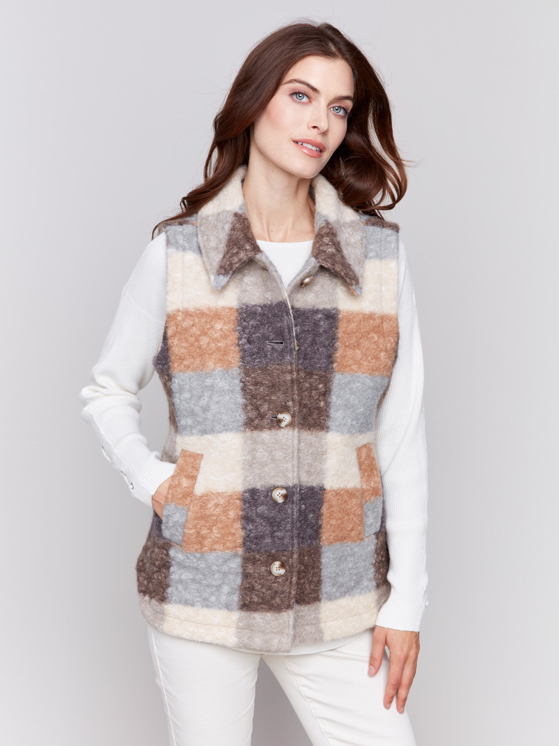 Terracotta colored plaid bouclé knit vest with spread collar and button closure by Charlie B.