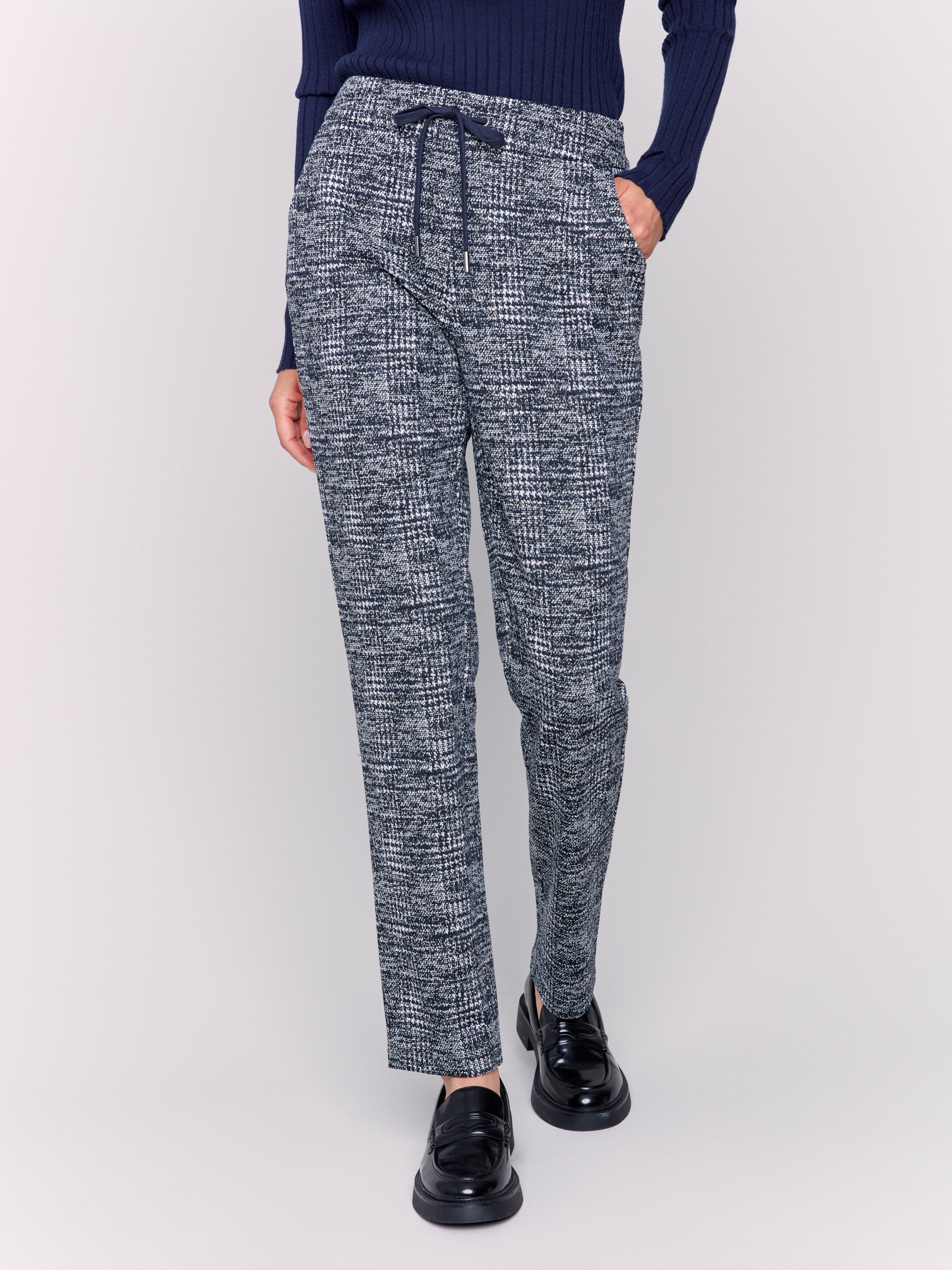 Plaid knit jogger pants in navy with a mid rise and slim leg fit, featuring an adjustable drawstring waist and side pockets by Charlie B.