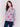 Heather grey sweater with pink floral print and a round neckline by Charlie B.